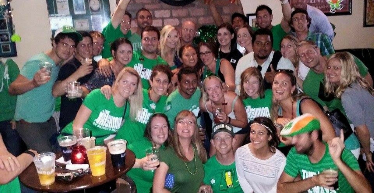 Friends enjoying a lively gathering at The Irishman in Huntington Beach