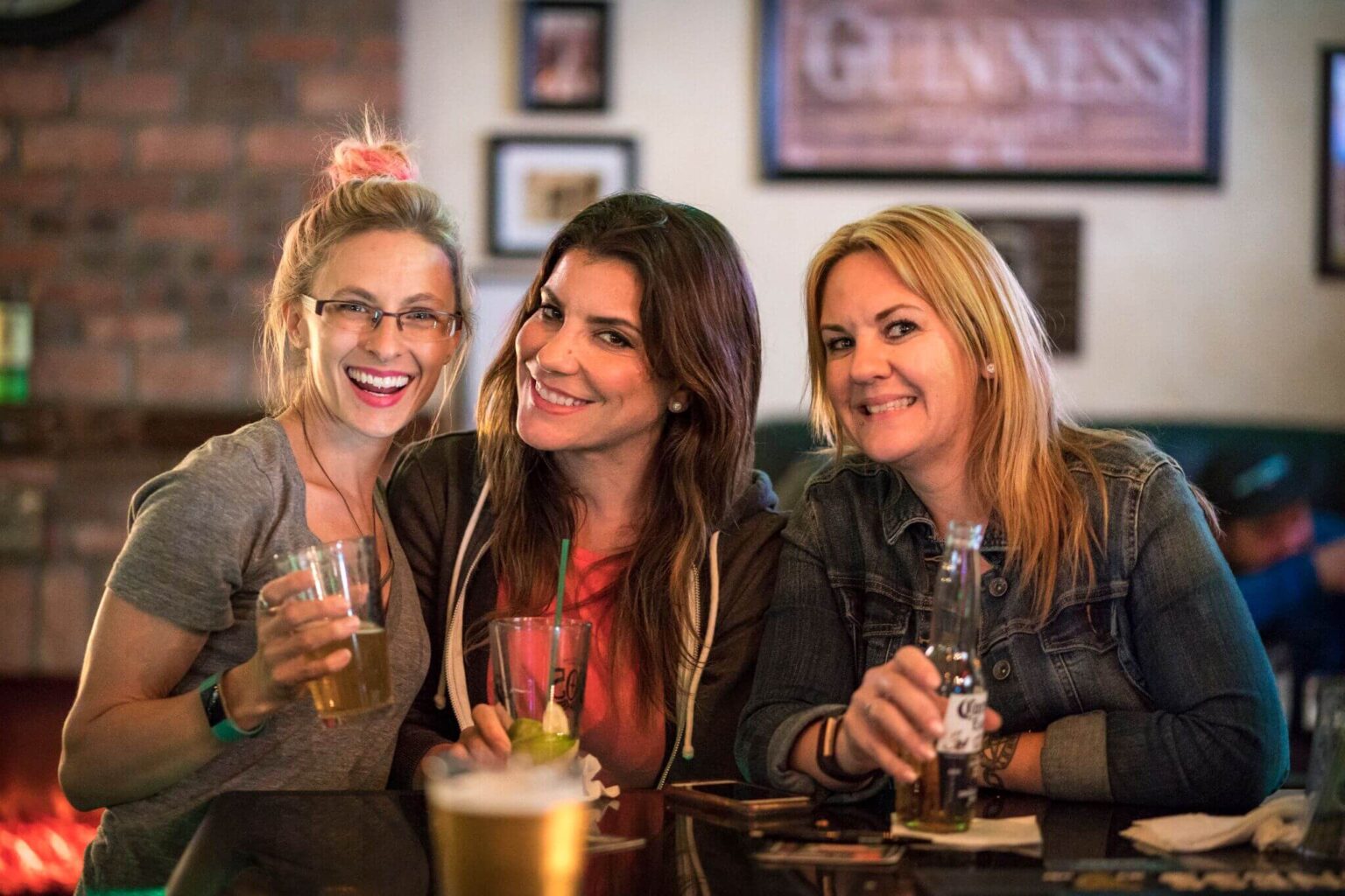 Guests enjoying drinks together at The Irishman pub